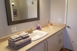 Spacious bathroom. Includes a brand new shower/tub.