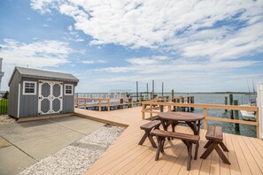 Shed w/ bikes, crab traps, fishing rods, cooler, sand chairs and shovels/buckets