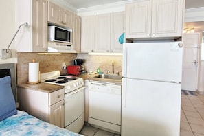 Kitchenette with full refrigerator, microwave, 4 burner / oven, dishwasher, coffee maker, toaster, etc.