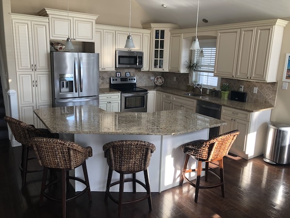Beautiful Kitchen with granite counter tops and stainless steel appliances