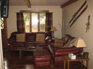 Comfortable living room with wood burning fireplace for the cool evenings.