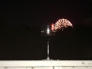 "Tall glass of something" view of fireworks from the deck