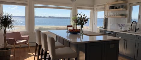 New kitchen with river view! Fully stocked, with pantry for storage.