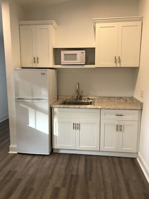 Kitchen with refrigerator, microwave, coffee maker and toaster oven (not shown)