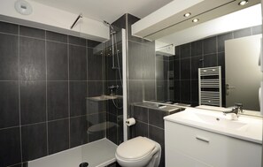 This bathroom features a shower and tub combination.