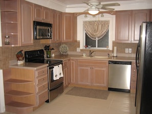Updated kitchen with all need to cook, eat and clean while enjoying vacation.