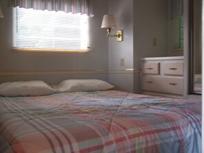 Queen Size bed in Bedroom with built in Dressers