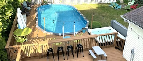 Yard has it all...large heated pool, large deck, hot tub, beautiful landscaping