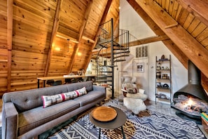 Modern furniture and decor fill this lovely A-Frame