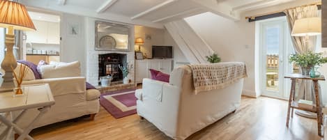 First & Last, Trimingham: Sitting room with electric flame stove