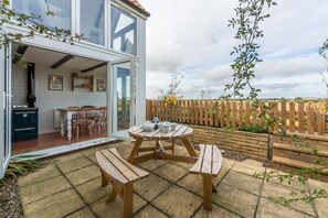 First & Last, Trimingham: Rear courtyard garden and views from the cottage