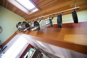 Hanging overhead pot rack and skylight