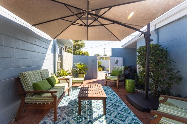 Outdoor seating area looking toward guesthouse entrance
