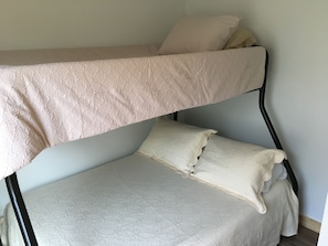 Twin on top, full size mattress on the bottom. 