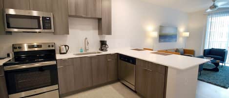 Modern Kitchen with Whirlpool Stainless Steel Appliances - Corporate Housing Atlanta - 1-Bedroom Spectacular Suites