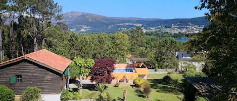 Rosal Lodge looking over the pool, towards Rio Mino and Portugal