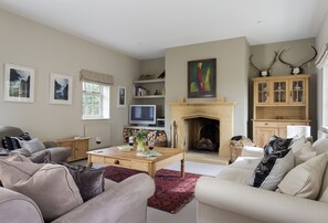 Ground floor: Sitting room with comfortable sofas