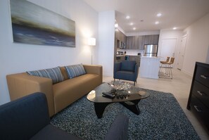 Contemporary Open Kitchen and Living Room - Weekly Rooms for Rent Near Me - 1-Bedroom Spectacular Suites