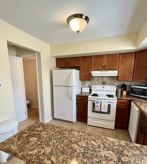 Kitchen with microwave, stove, oven, dishwasher and Keurig 