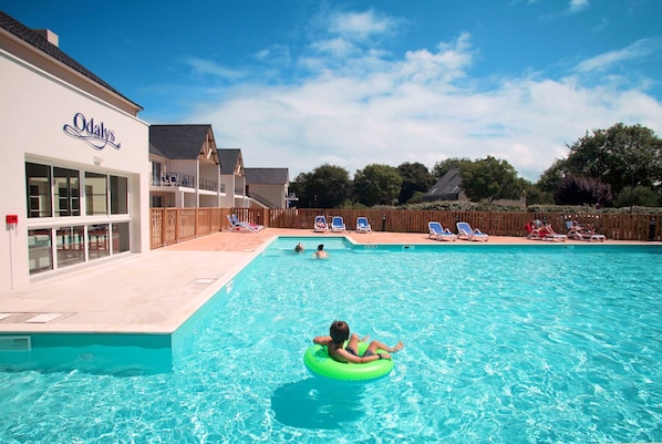 Lounge by the pool in the sunshine.