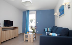 Sink into the cozy sofa after a day exploring the area.