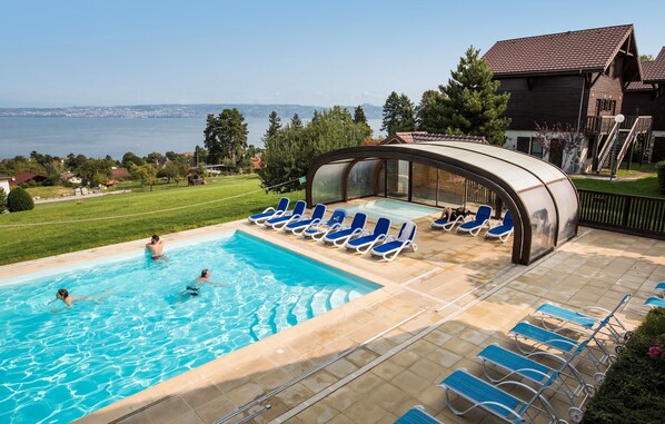 Lounge by the pool in the sunshine.