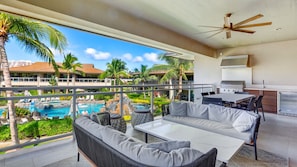 Oversized lanai with a private outdoor kitchen overlooking the secluded pool 