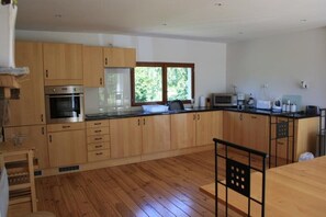 Fully fitted kitchen with oven, hob, fridge freezer, dishwasher, microwave etc.