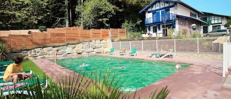 Lounge by the pool in the sunshine.