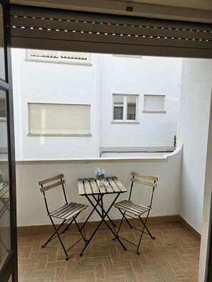 Balcony with table for outdoor meals