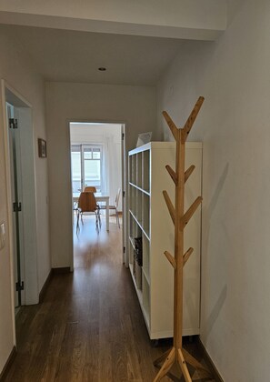 Bright hallway with wooden coat rack