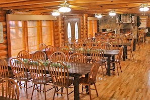 Spacious dining room with gorgeous hardwood flooring- seats up to 60