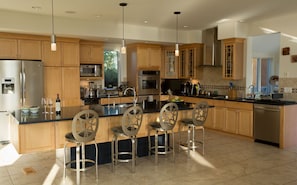 open state of the art kitchen adjacent to dining and living room