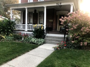 Big front porch with rockers and table for eating out, hanging out