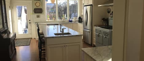 Huge kitchen in historic house.  Great sun in the morning, big marble island. 