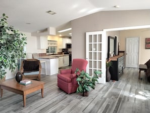 Open, comfortable seating area flows into kitchen