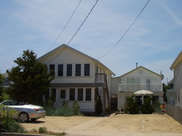 Cottage is set back, to the right