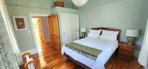 Front extra large room with queen bed and build in wardrobe.