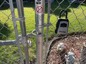 private lock box for keys for self checkin in front of parking along side house