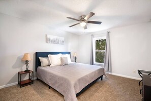 Master bedroom located on main level. King size bed with memory foam mattress and blackout curtains. 