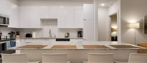 Fully Equipped Kitchen with Island Bar Seating - BCA Furnished Apartments - 2-Bedroom Spectacular Suites