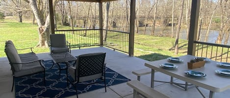 Extra Large Porch overlooks a river. Sit, write, sketch, and watch birds.