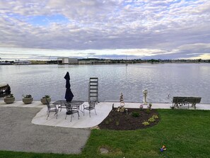 Patio seating and swim ladder. To access, make two right turns down the driveway