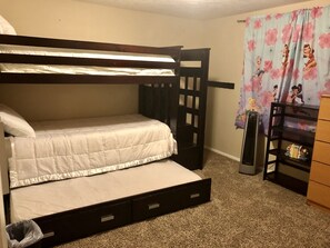 Kids room bunk bed with trundle. Also pack and play and air mattress in closet. 