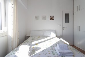 Bright bedroom with confortable bed spleeping two people