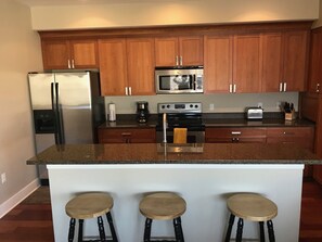 Open concept kitchen w/ island seating