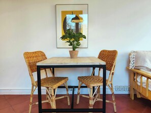 Enjoy a meal at the small dining table, perfect for two.