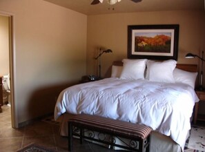 Upscale king mattress and bedding in master.  French door access to patio.