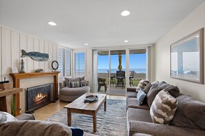 Cozy up by the fully functional fireplace—and enjoy your front row view of the ocean!