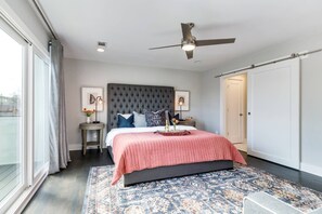 Master bedroom with a private, walk out balcony with downtown views